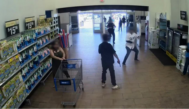 Screenshot 2023-03-21 at 01-08-01 GRAPHIC Caught on camera Officer shoots at armed suspect in Walmart